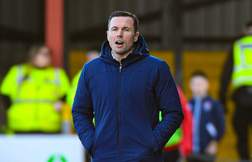 Ross County manager Don Cowie shouts instructions from the touchline.