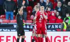 Aberdeen's Kristers Tobers is show a second yellow by referee Nick Walsh for a foul on Kilmarnock's Liam Donnelly. Image: SNS.