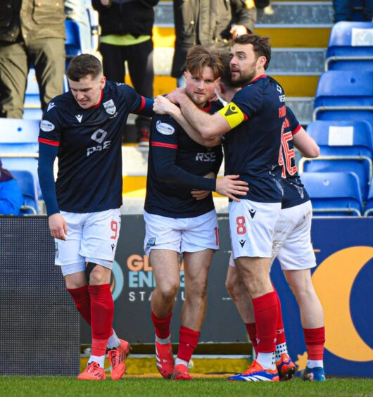 Ross County players congratulate Noah Chilvers following his goal against Dundee. 