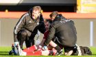 Aberdeen's Nicky Devlin receives treatment before being forced off by injury in the 1-0 win against Kilmarnock. Image: SNS