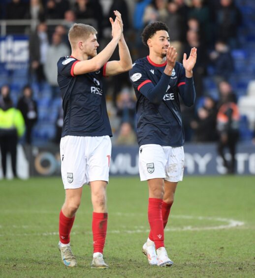 Kieran Phillips and Jonathan Tomkinson applaud Ross County's supporters following the win against Dundee. 