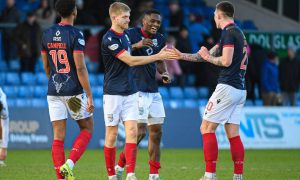 Kieran Phillips shakes the hand of team-mate Kacper Lopata after scoring for Ross County against Dundee.