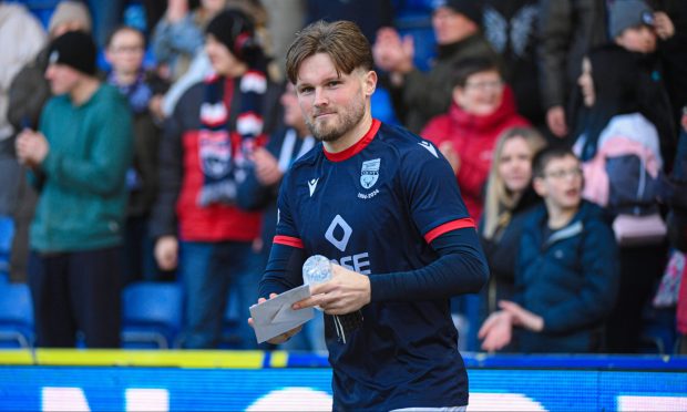 Noah Chilvers smiles after being given a birthday card following the win over Dundee.