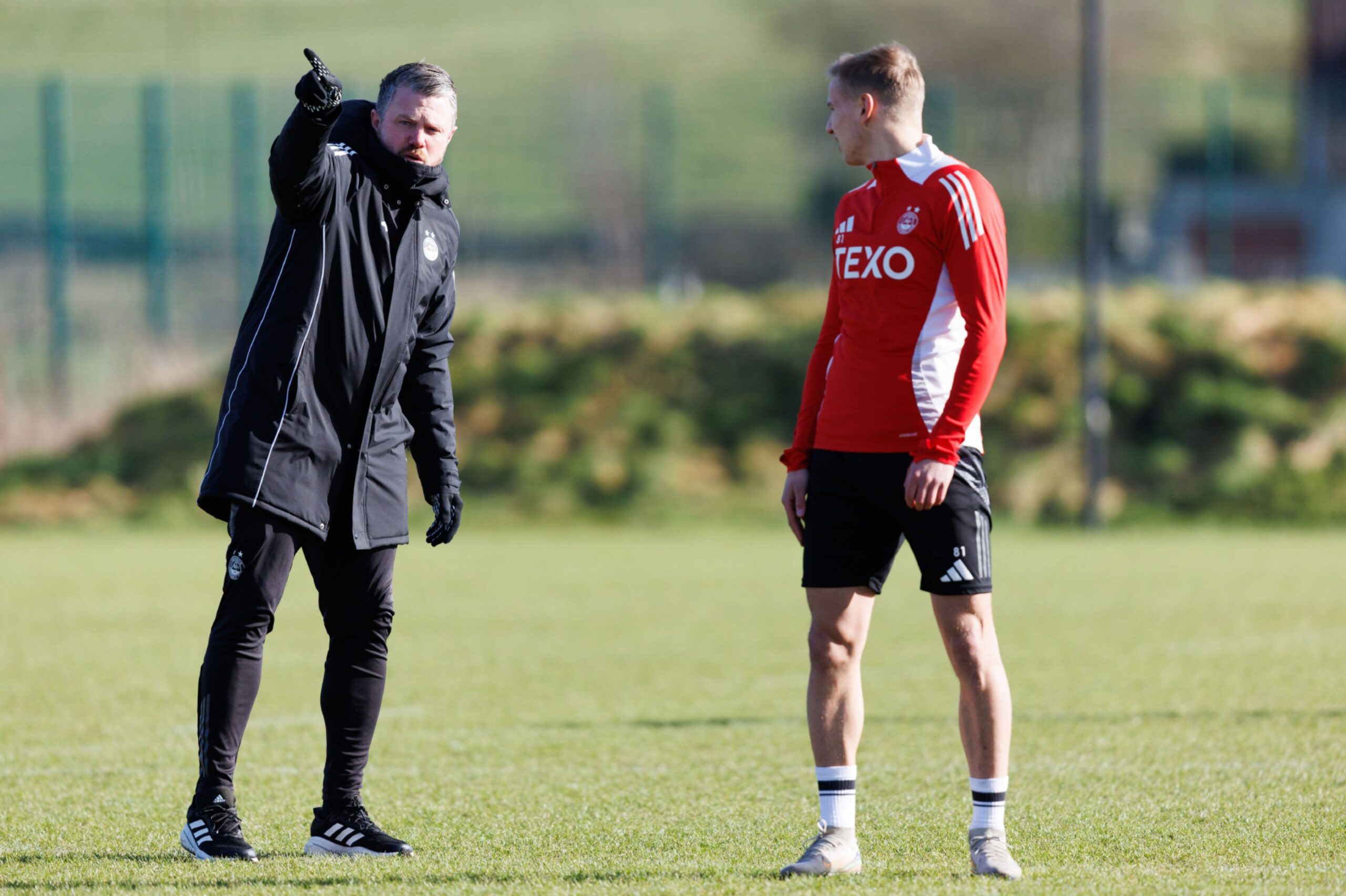 Manager Jimmy Thelin and Topi Keskinen (R) during a training session at Cormack Park. 