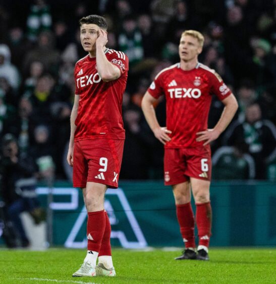 Aberdeen striker Kevin Nisbet, left, looks dejected against Celtic. Image: SNS.