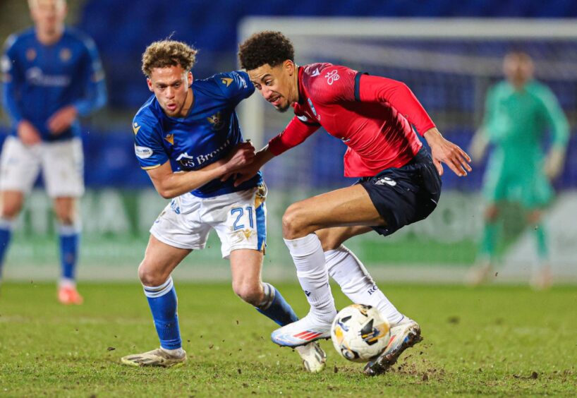 Jonathan Tomkinson controls the ball for Ross County against St Johnstone.