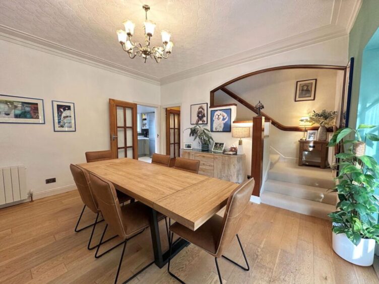 the spacious dining room is open to the staircase