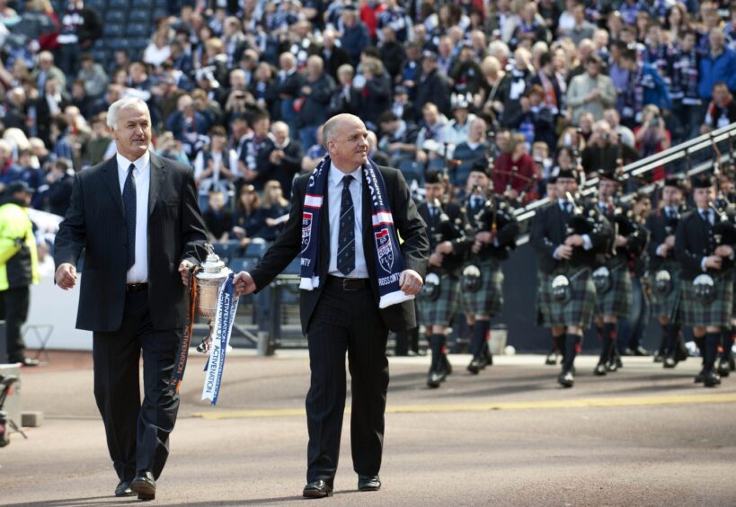 Billy Ferries parades the Scottish Cup trophy alongside Ivan Golac ahead of the 2010 Scottish Cup final between Ross County and Dundee United. 