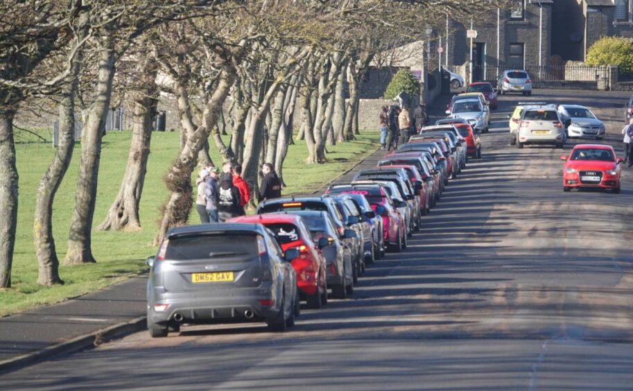 Cars waiting to pay tribute to Kaden Askew in Wick 