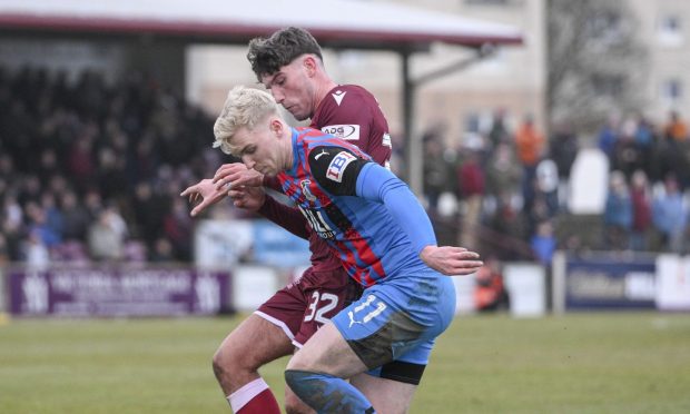 ICT winger Luis Longstaff is challenged by Arbroath's Alasdair Spalding.