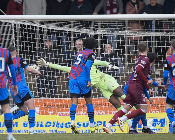 Inverness Caledonian Thistle goalkeeper Musa Dibaga pushes a Scott Stewart effort for Arbroath past the post during the SPFL League One match at Gayfield Park, Arbroath, on Saturday, February 8, 2025. Image: Dave Johnston.