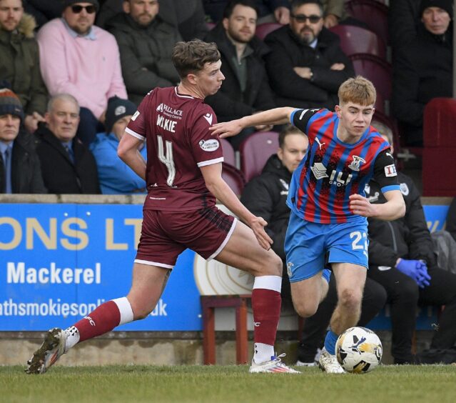 Inverness Caledonian Thistle defender Keith Bray breaks away from Arbroath's Jack Wilkie.