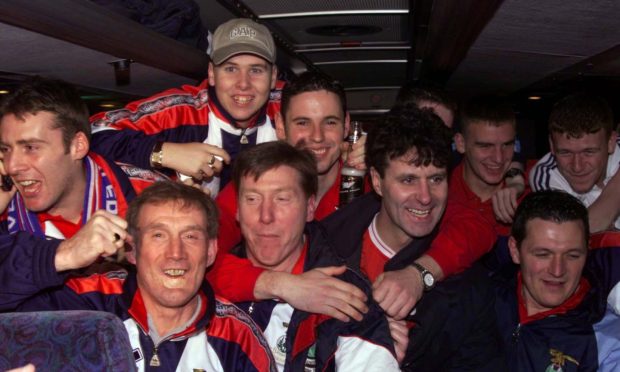 Inverness Caledonian Thistle players and manager Steve Paterson celebrate after their famous 3-1 Scottish Cup win over Celtic at Parkhead, Glasgow, on Tuesday, February 8, 2000, in the Scottish Cup.