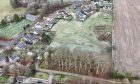 Aerial view of the development land for sale at Rothiemay.