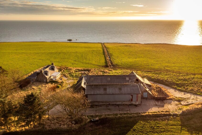 Aerial view of the the farmhouse and farm buildings