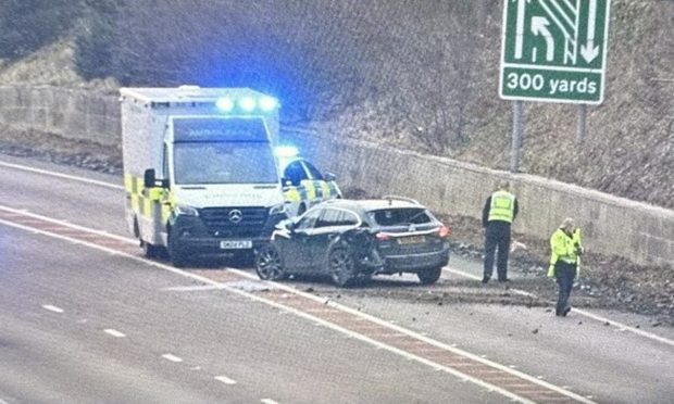 Police car and ambulance in front of a damaged car on the Fochabers bypass.