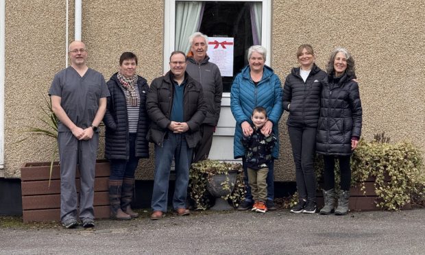 To go with story by Andrew Morton. Insch Hospital supporters have hailed new funding for a dementia support group that they hope will be held inside the community hopsital, which was mothballed almost five years ago.  Picture shows; From l-r, GP Paul Davies, Kerry Smith, Morris Tait, Alasdair MacCallum, Jane Reid, Jenny Robertson, Allison Grant. Insch War Memorial Hospital. Supplied by Friends of Insch Hospital Date; 03/02/2025