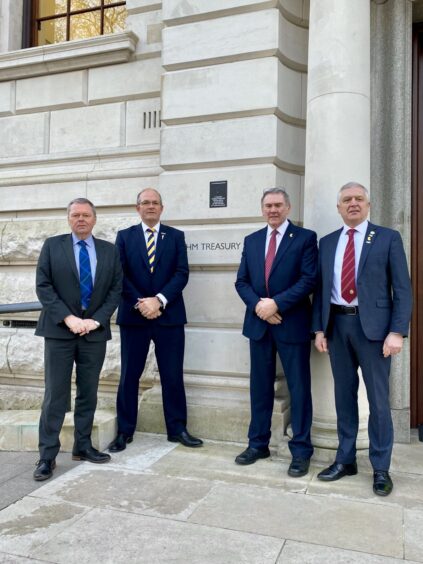 Farming union presidents Andrew Connon, NFU Scotland, Tom Bradshaw, NFU, Aled Jones, NFU Cymru, and William Irvine, Ulster Farmers' Union, outside the Treasury.