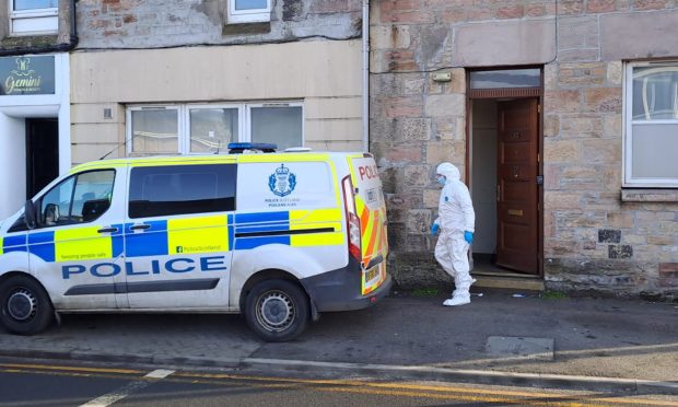 Forensics entering a property. Image: Alberto Lejarraga/DC Thomson.