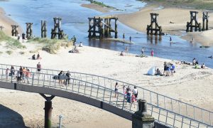 Walker crossing bridge at Lossiemouth beach.