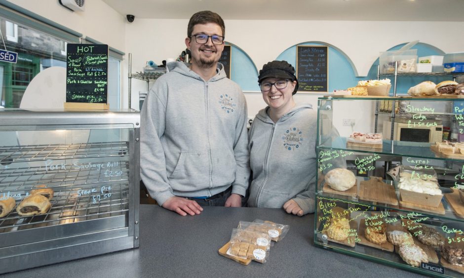 Ruby and Lewis Smart behind Mini Bakes counter. 