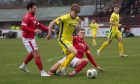 Buckie's Lyall Keir, centre, evades Liam Callaghan, left, and Kevin McHattie of Brechin. Photos by Kim Cessford/DC Thomson.