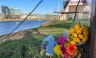 Floral tributes have been left in memory fof Henrietta and Eliza Huszti at the River Dee, Image: Kenny Elrick/DC Thomson