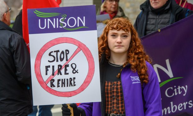 Workers protested ahead of the meeting.