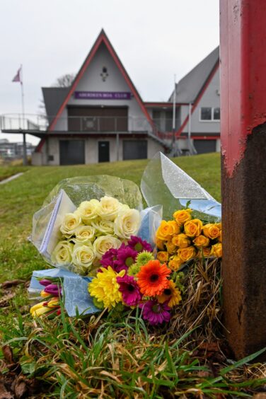 Floral tributes laid at Aberdeen Boat CLub in memory of Eliza and Henrietta Huszti. 