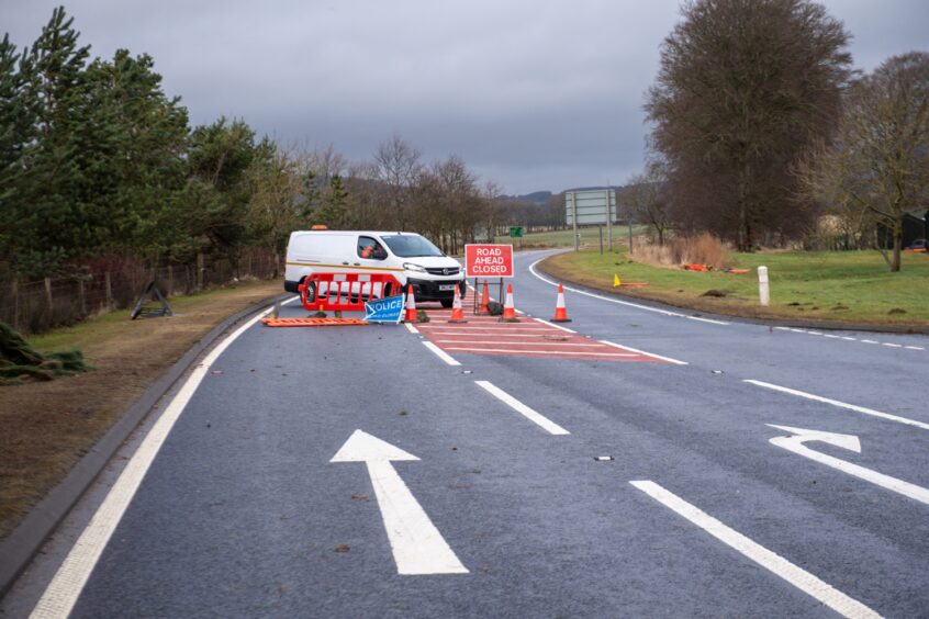 White van and conces block the A96.