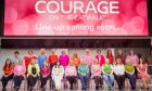 Courage on the Catwalk models in front of Courage sign