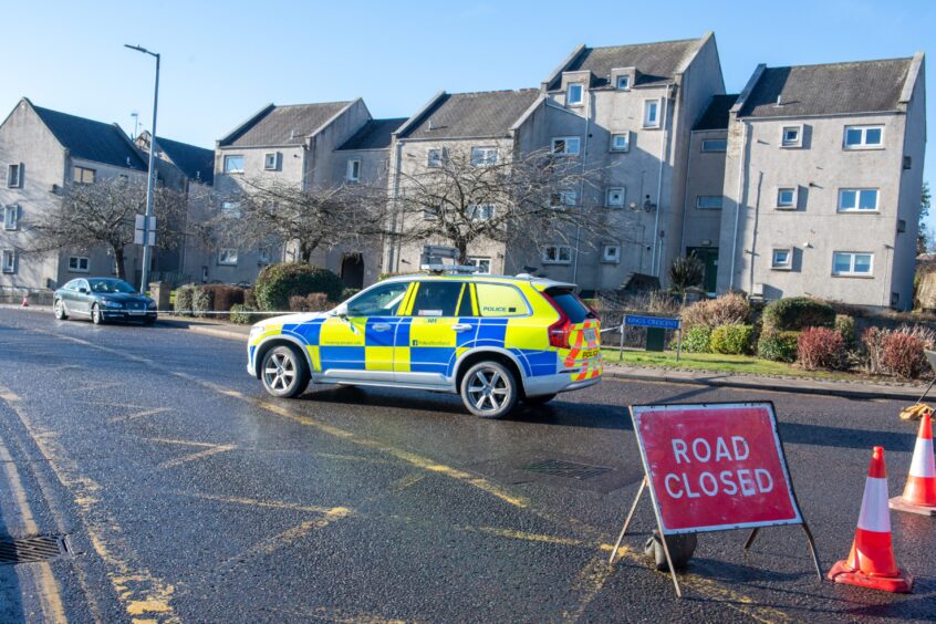 Police car and road closed sign at Mounthooly Way