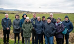 Daviot residents with the site of the proposed crematorium in the distance. Image: Kami Thomson/DC Thomson