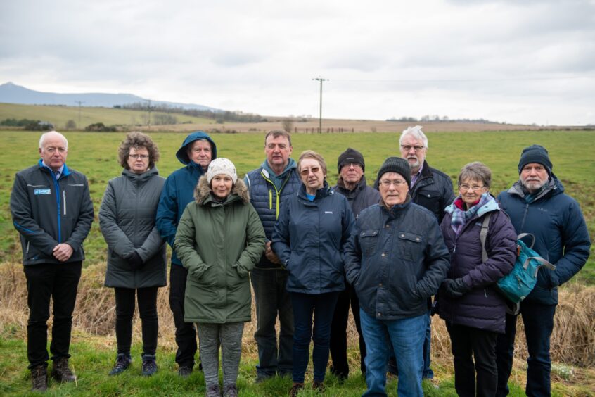 Daviot residents with the site of the proposed crematorium in the distance. Image: Kami Thomson/DC Thomson