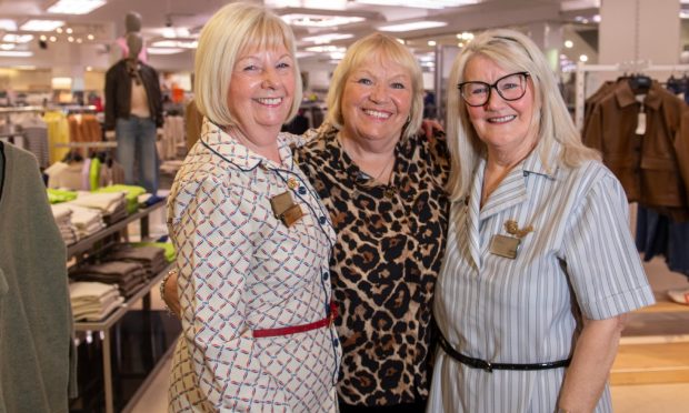 Turning up in their old uniforms, Linda Orawe (80's), Maureen McGregor and Jane Green (90's) bid final farewell to their beloved M&S store.