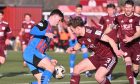 Caley Thistle forward Alfie Bavidge tussles with Kelty's Brody Paterson. Image: Dave Johnston.