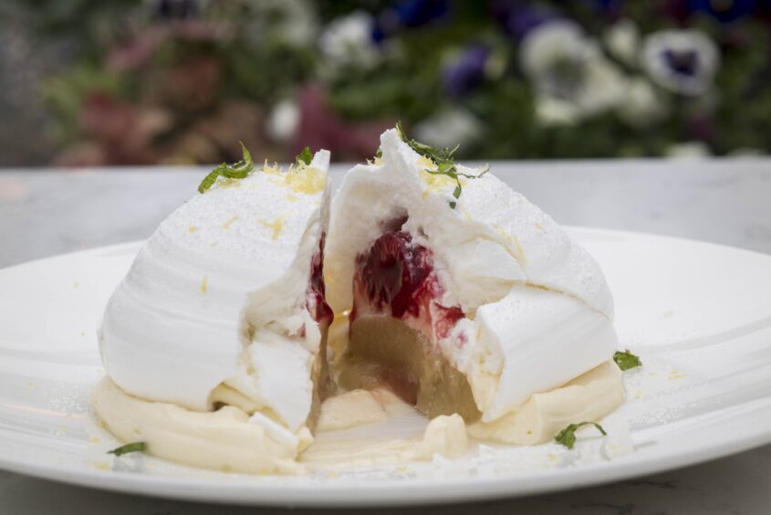 A delicious-looking meringue sits on a plate at the Chester Hotel.