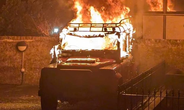 Land Rover engulfed in flames.