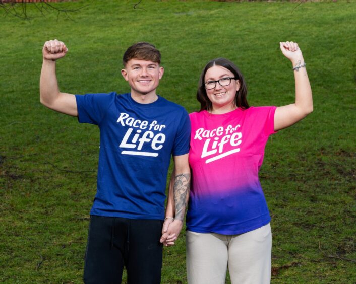 Chloe Reid and Jack McGinness wearing Race for Life T-shirts