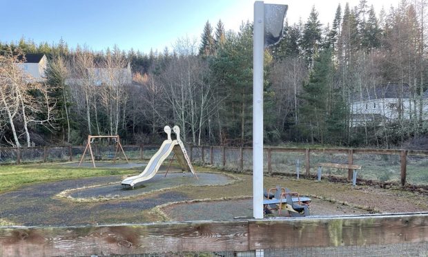 The 'for sale' sign has been trashed - but the playpark at Moray Park Gardens is still up for grabs. Image: DC Thomson