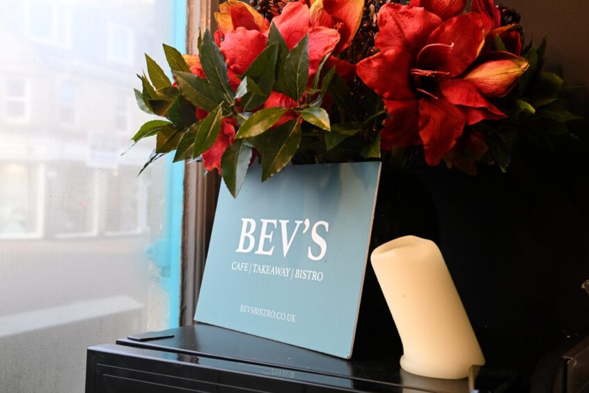 A Bev's Bistro sign sits in the window of the Holburn Street shop.