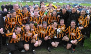 Huntly's players and management celebrate winning the Breedon Highland League in 2005.