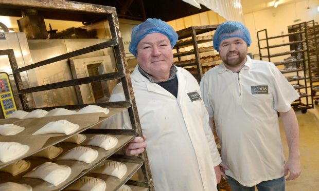 Ali Asher with his son Robbie at the family's Balmakeith bakery. Image: Sandy McCook/DC Thomson