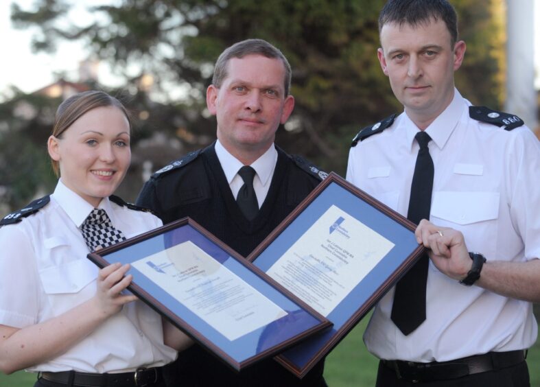 Northern Constabulary constables, Kayleigh Forsyth and Garry Ross yesterday received the Chief Constables Commendation from Chief Constable Ian Latimer (centre) at a ceremony in Alness Police Station. 