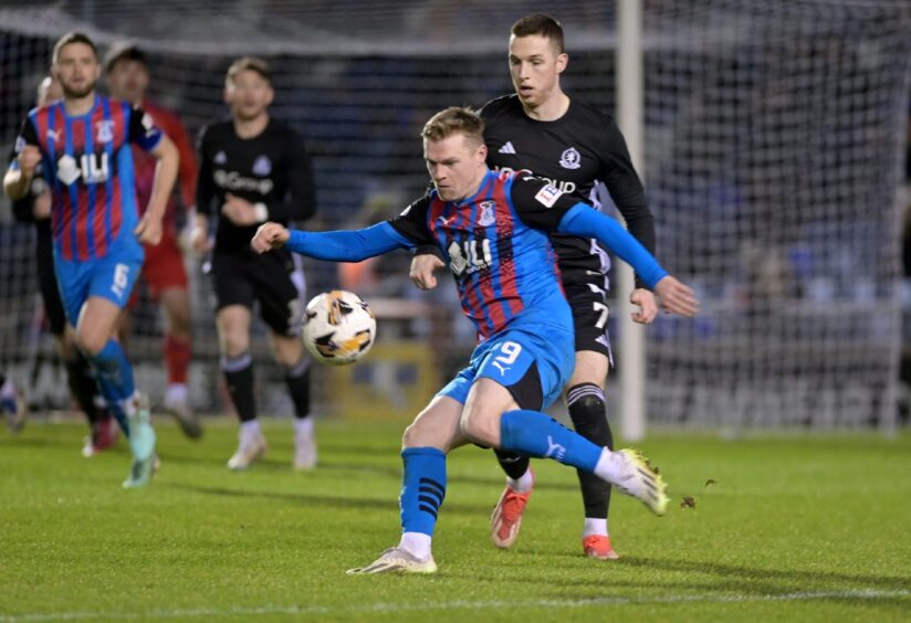 Inverness Caledonian Thistle striker Billy Mckay sends a right-footed pass up the park during his team's 4-1 SPFL League One defeat against Cove Rangers at the Caledonian Stadium, Inverness, on Saturday, December 28, 2024. 