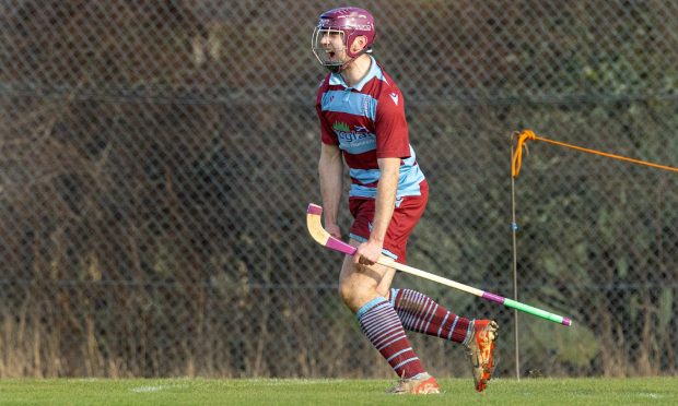 Penri Jones scores the only goal of the game to win the Macdonald Cup for Strathglass.  Image: Neil Paterson.