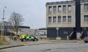 Police vehicle outside Dyce Academy.