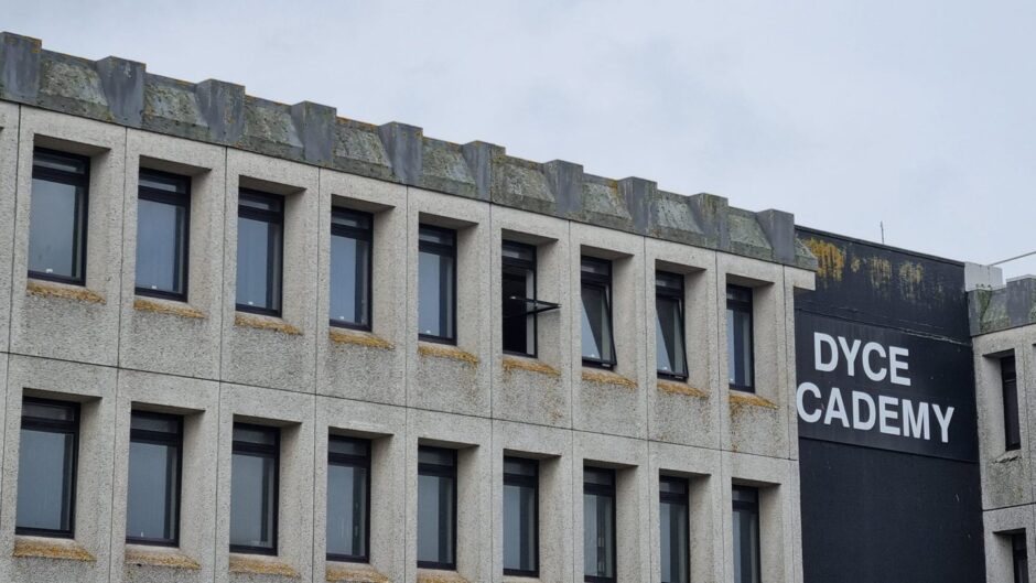 Dyce Academy building with open windows on the top floor.