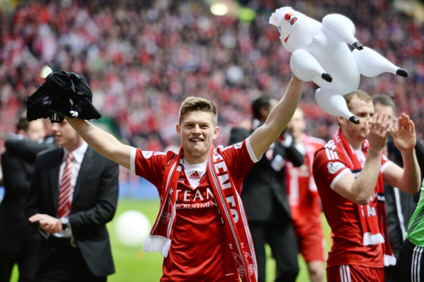 Cammy Smith celebrates Aberdeen's victory in the Scottish League Cup final in 2014. Image: SNS