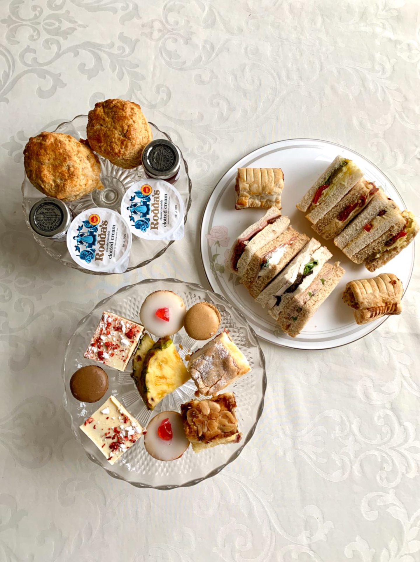 A selection of sandwiches, scones and desserts sit on plates at the Corner Tree Cafe.